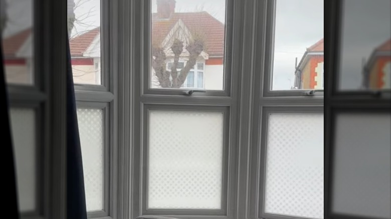 A bay window with the glass treated with privacy film