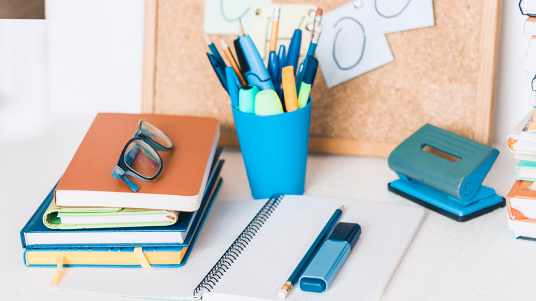 desk with blue pen holder