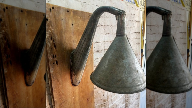 wood and metal funnel wall sconce