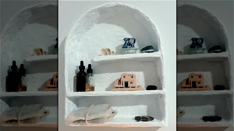 white papier-mâché wall shelf