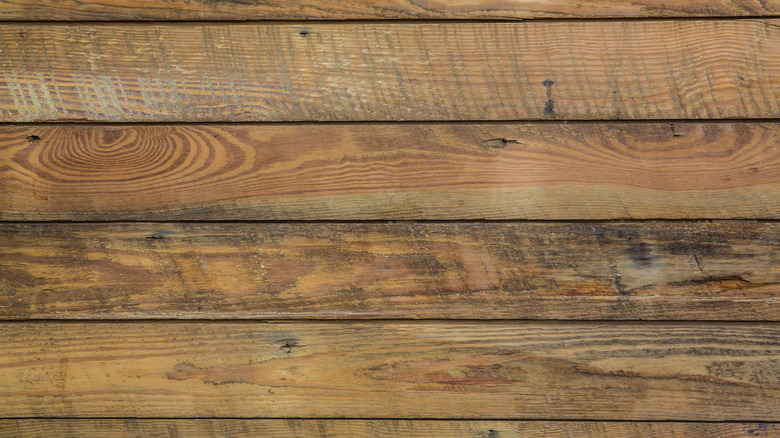 A close up of weathered barnwood panels