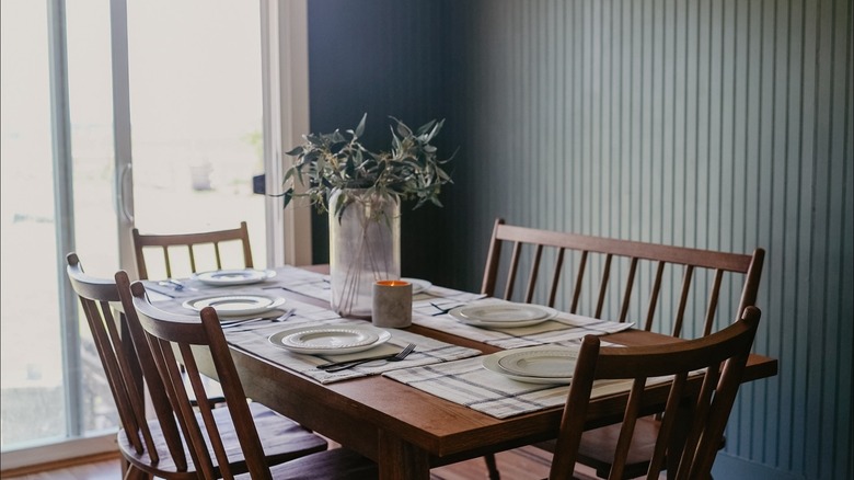 Green beadboard in a modern dining room