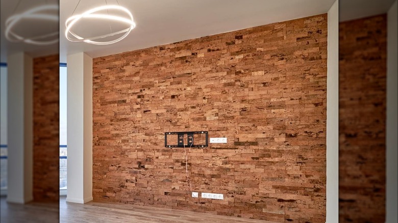 Cork board walls being installed in a contemporary home