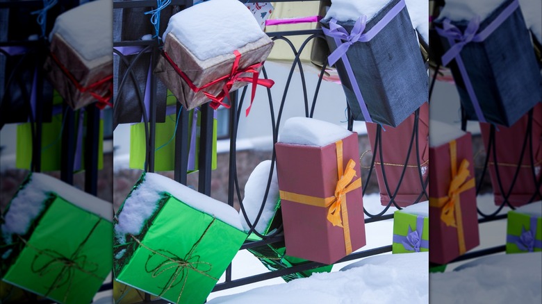 Faux gift boxes hung on a fence