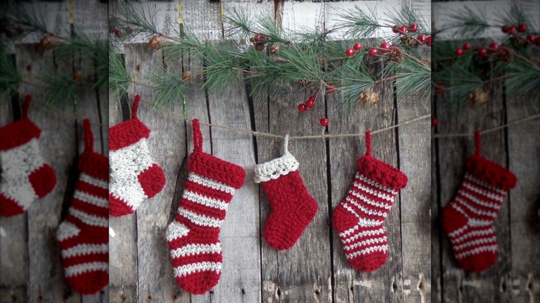 Red and white stocking garland on fence