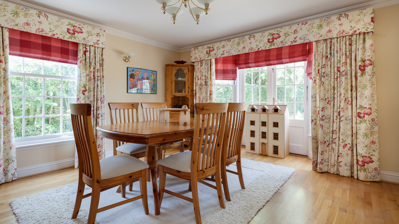 Floral print and plaid curtains in a traditional dining room