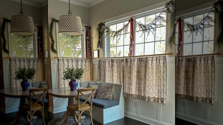 Toile-print cafe curtains in a dining nook