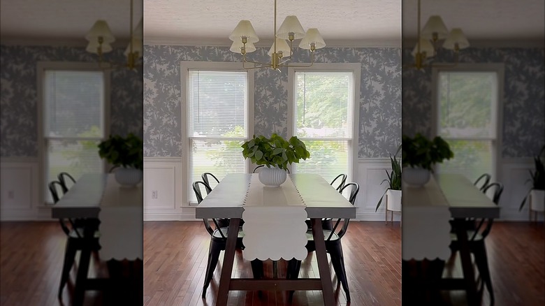 Traditional dining room with wallpaper and Venetian blinds