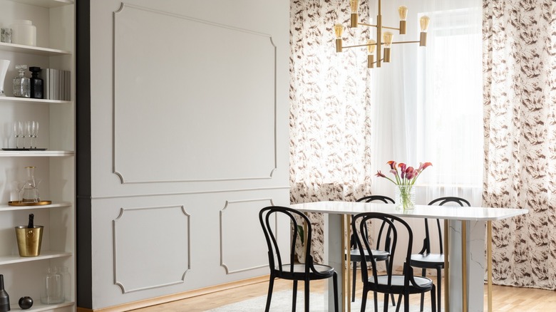 Sheer white and patterened curtains in a dining room