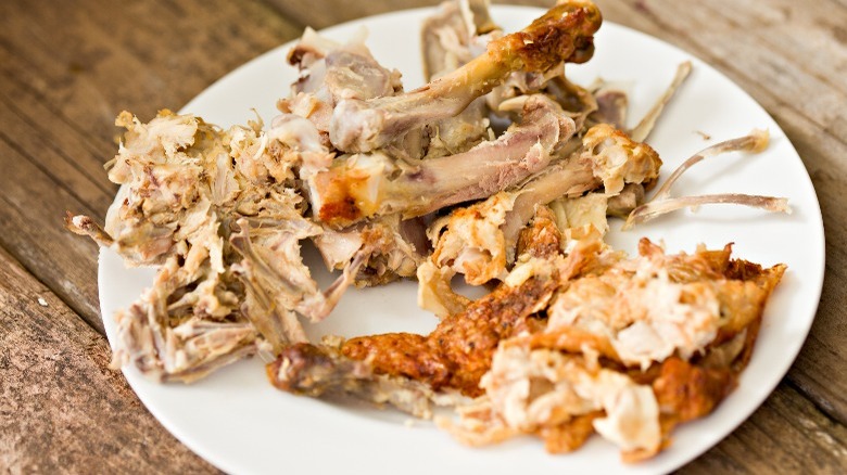 Plate full of chicken bones