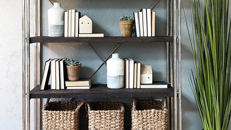 three baskets on bottom shelf