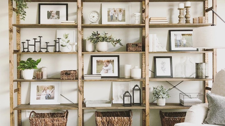 large photographs on wooden shelves