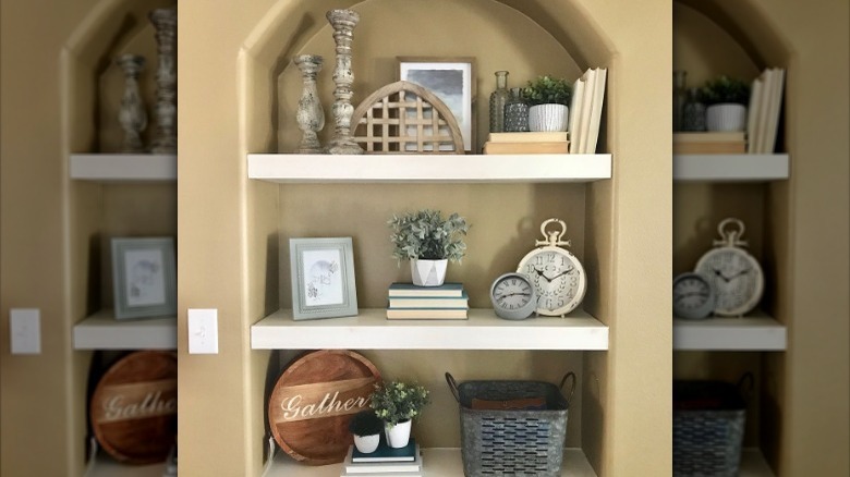 layered items on beige shelves