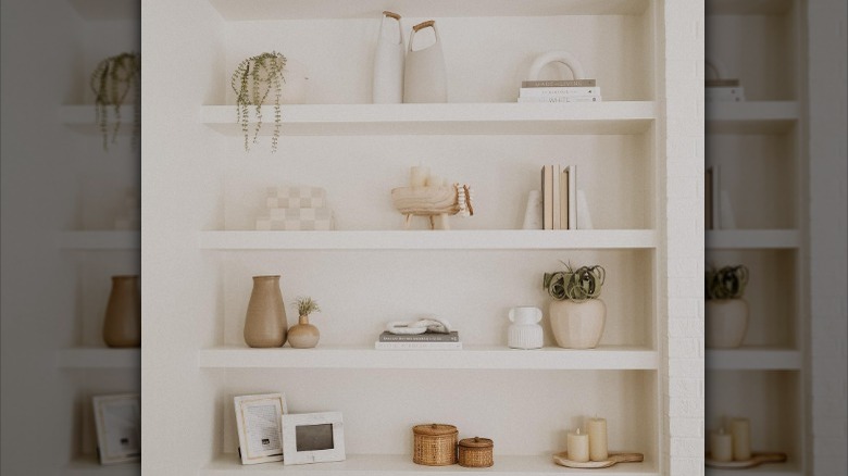 beige shelves with neutral decorations