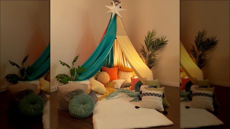 colorful blanket tent with pillows