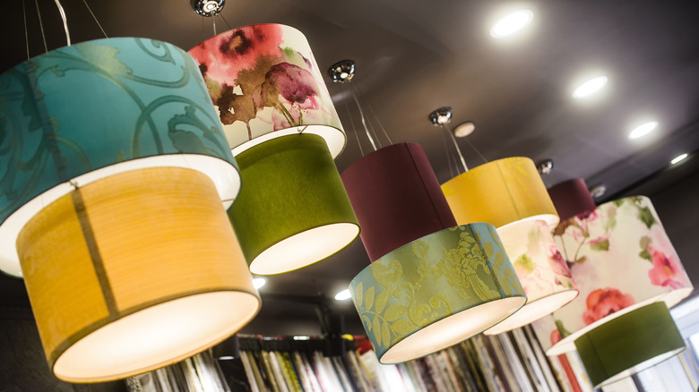 patterned lampshades hanging from ceiling