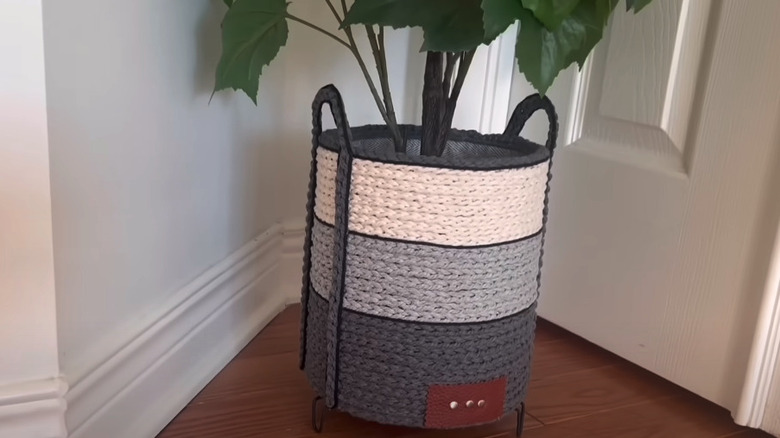 Macrame woven planter on floor