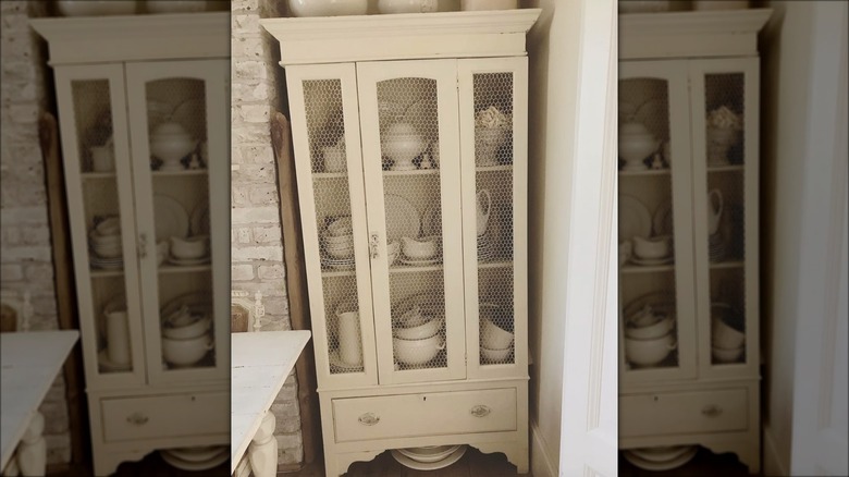 cabinet with chicken wire doors