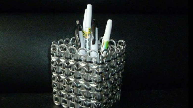 Soda can tab pen holder on chair