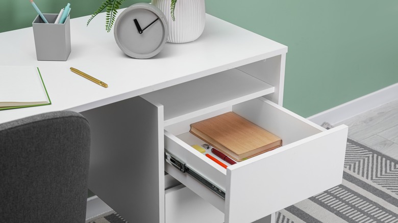 Desk with open drawer