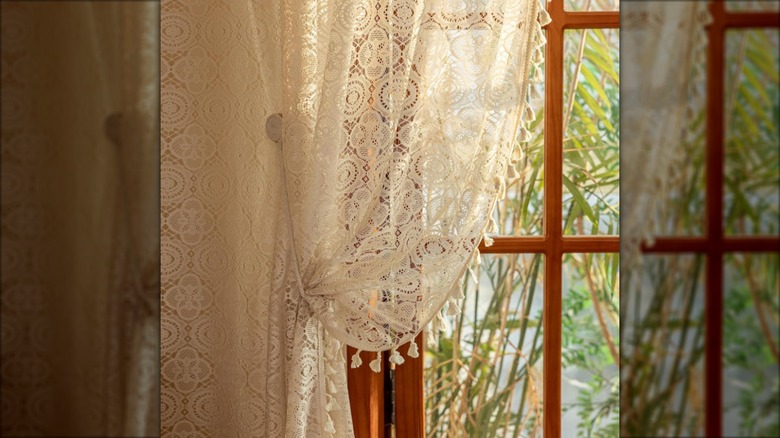 lace panel against wood window frame