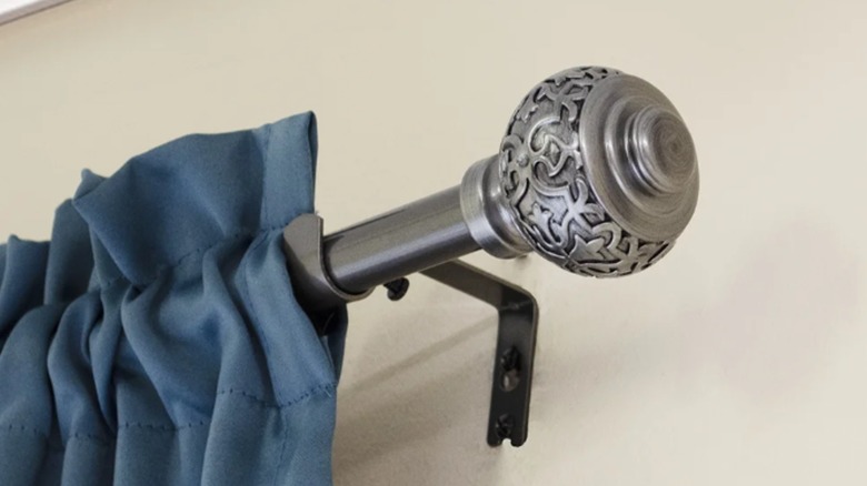 Engraved silver bulb curtain rod accent