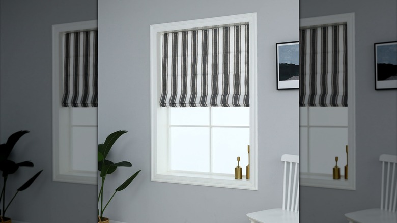 Striped Roman shade in window