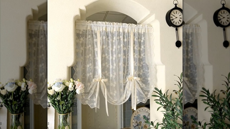 Lace tie-up curtains in window