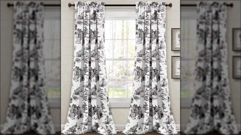 Black and white toile curtains on window