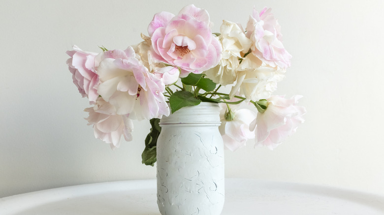 wilting pink flowers in vase