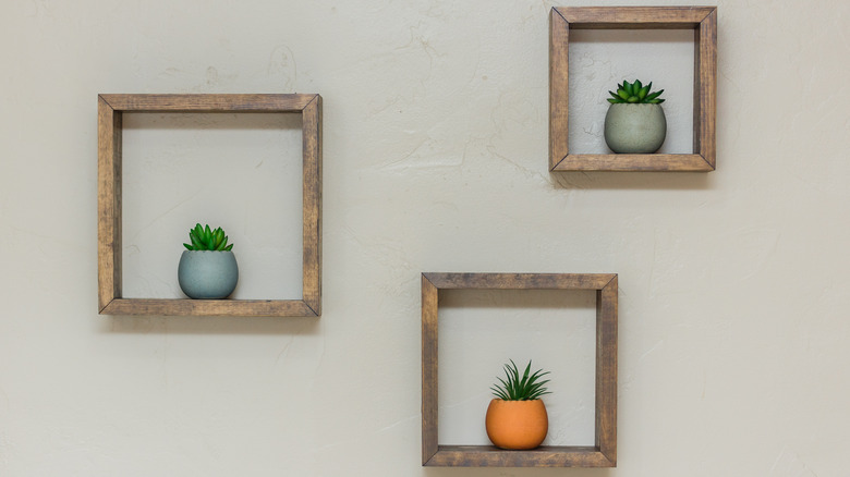 three square shelves on wall