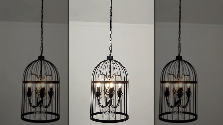 A birdcage chandelier hanging from a ceiling