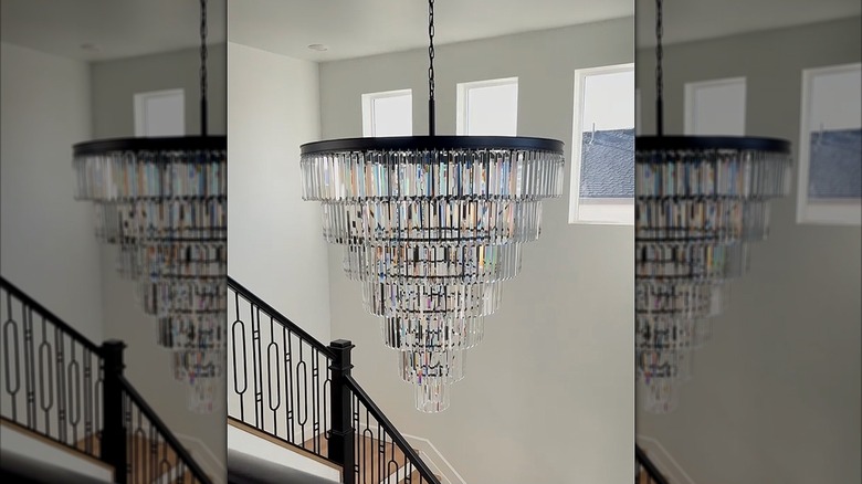 Crystal chandelier hanging from the ceiling in an entryway