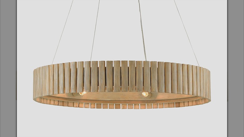 Wood drum chandelier suspended in the air