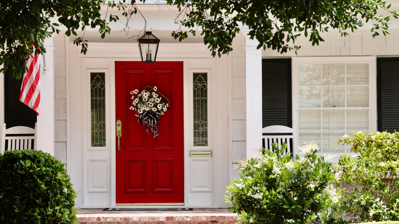 Red door on white house