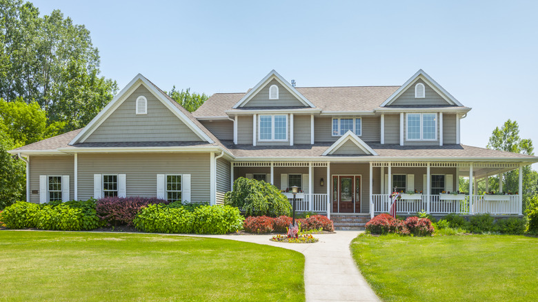 Tan home with white trim