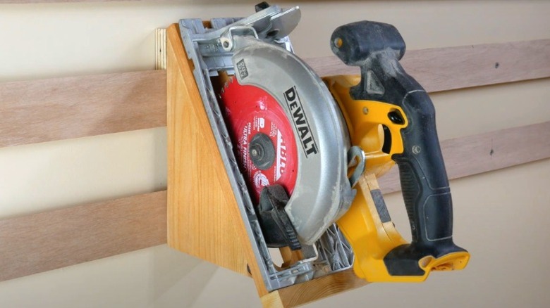 DeWalt cordless circular saw on angled French cleat holder