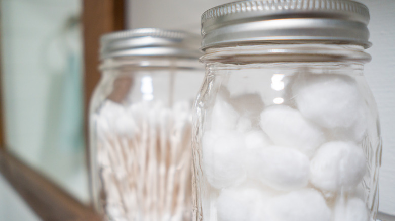 jar with cotton balls and q-tips