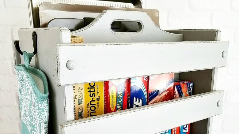 Magazine rack holding kitchen clutter