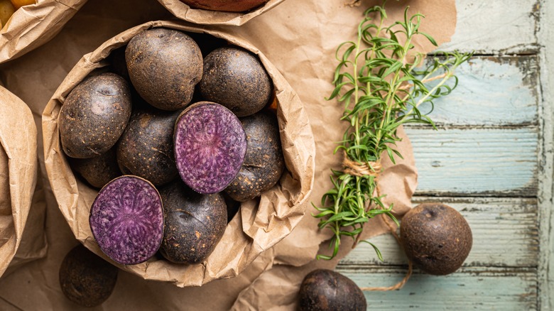 purple potatoes in paper bag