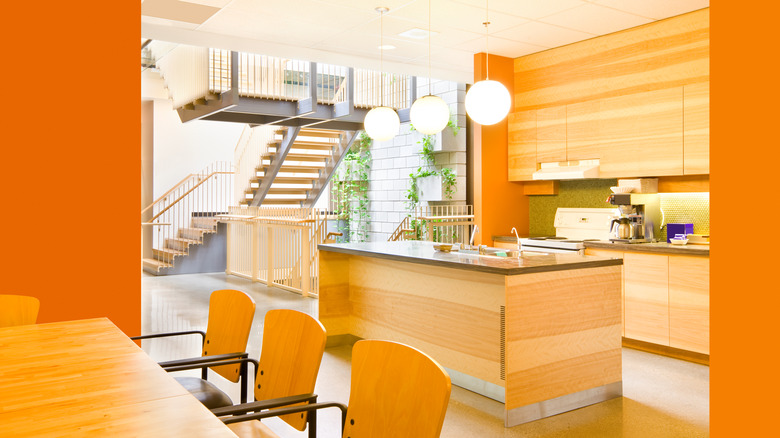 orange kitchen with wood accents