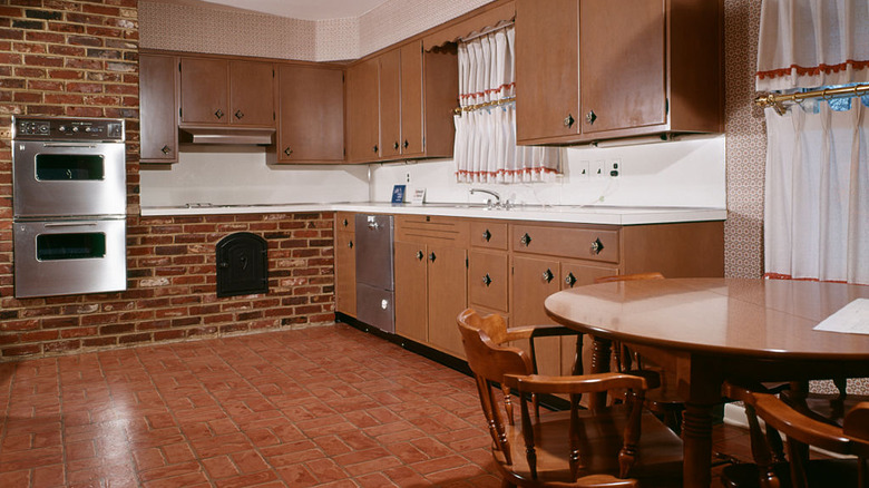 brown kitchen with brick linoleum flooring