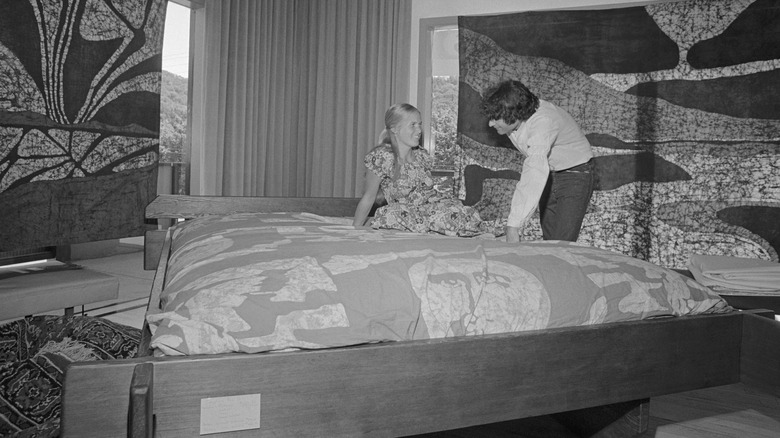 salesman selling woman waterbed