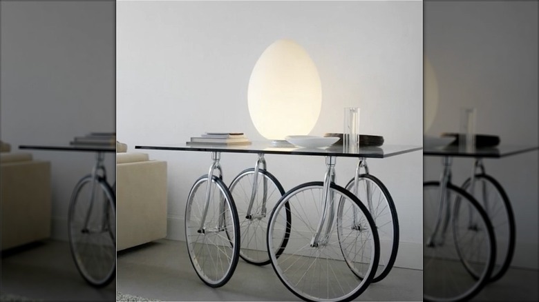 glass table with bike wheels