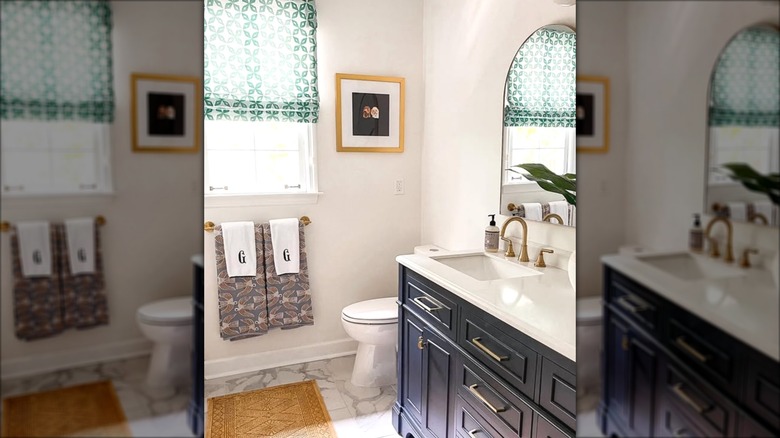 Bathroom with sheer green Roman shades over window