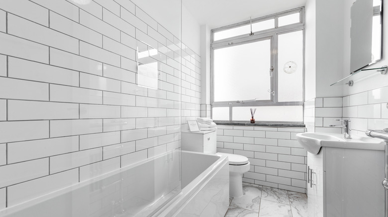 White bathroom with frosted glass window