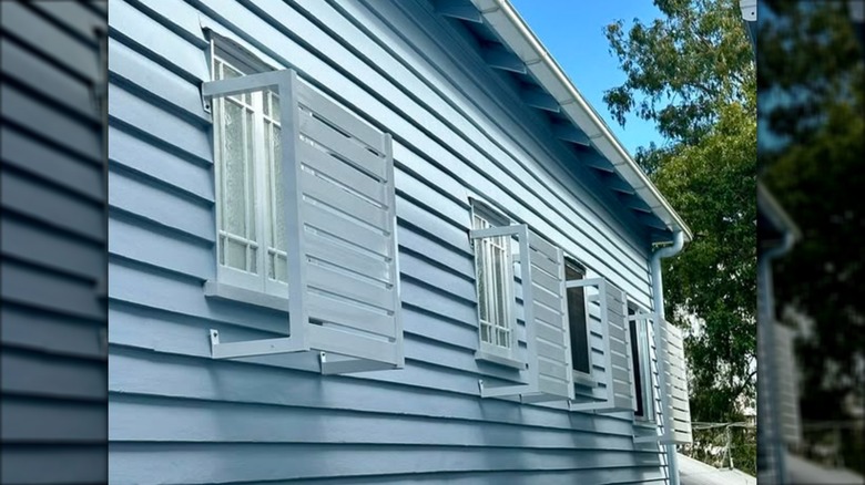 Exterior of house with privacy screens on windows