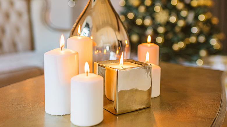 Six candles pillars placed on a wood table