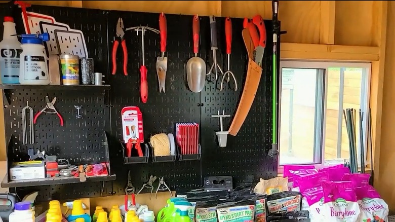 Gardening tools on open shelves