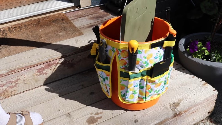 Gardening tools in bucket